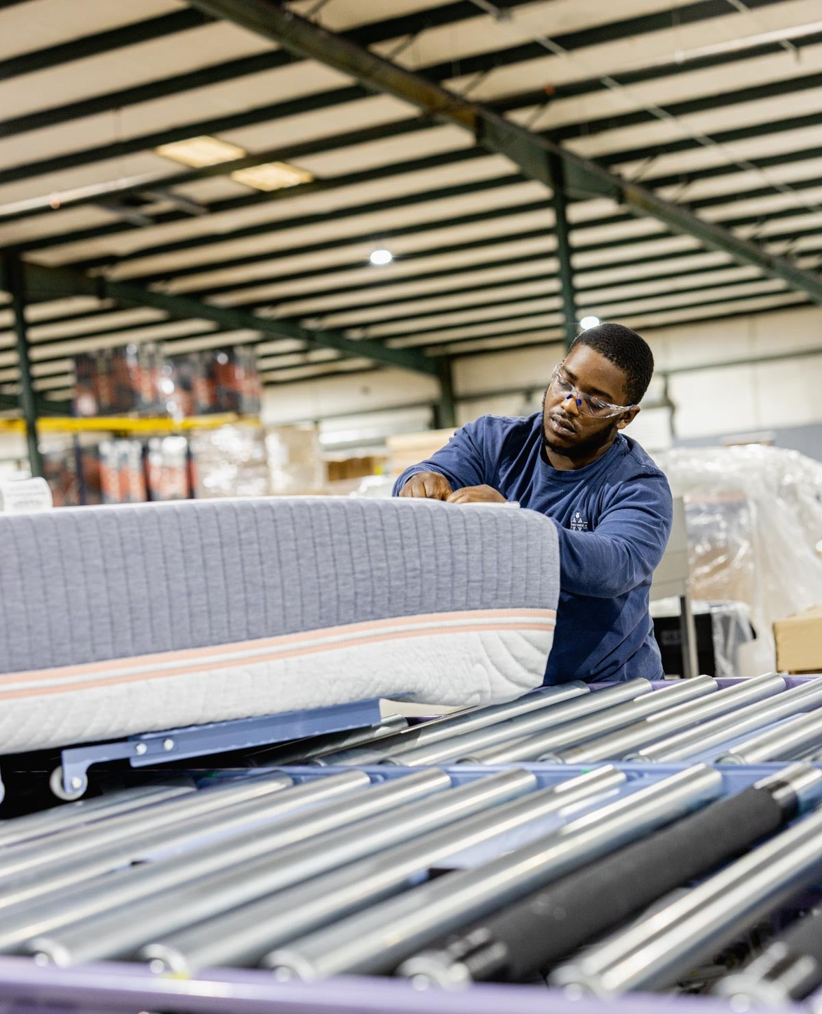 Worker Making A Mattress At The Sandman Bedding Factory In Mississippi
