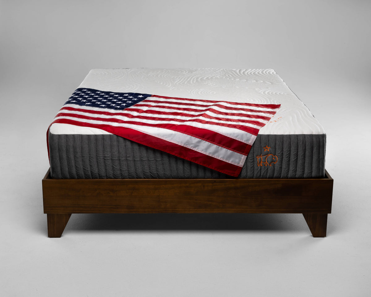 Mattress with American flag on a gray background