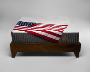 Mattress with American flag on a gray background